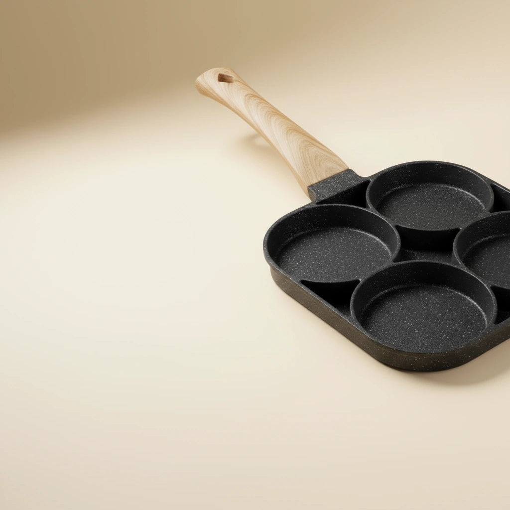 Poêle Mini Pancake : gros plan sur les quatre cavités rondes.