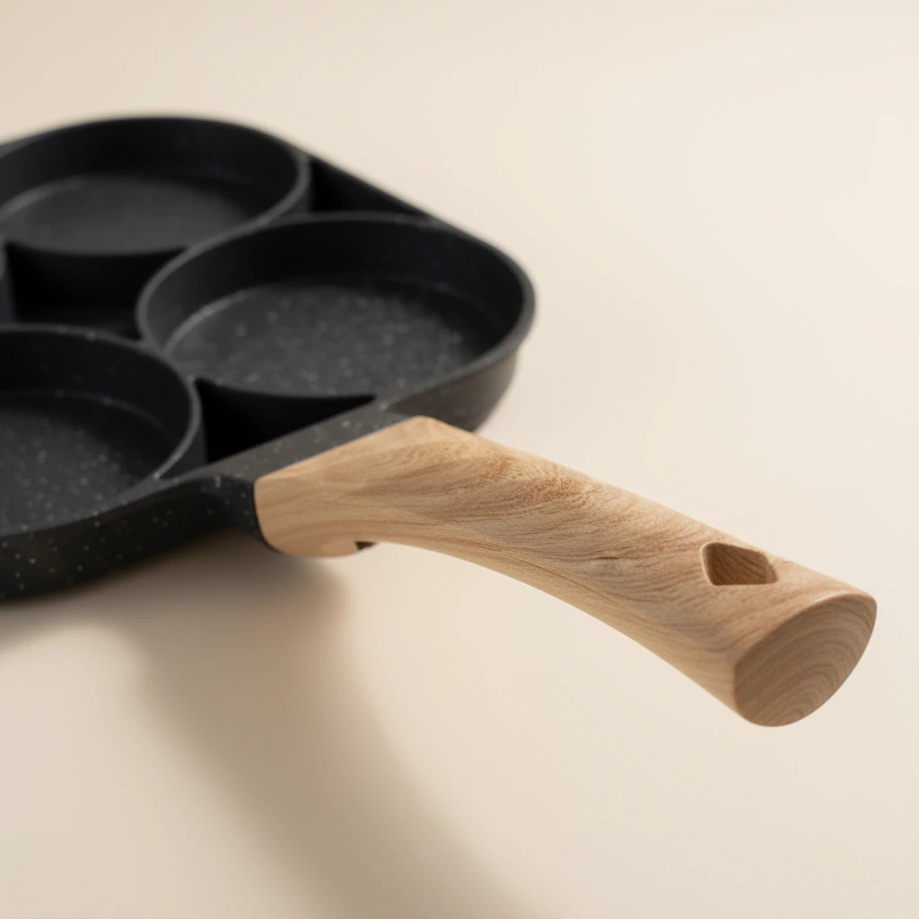 Poêle Mini Pancake : gros plan sur le manche et les cavités.